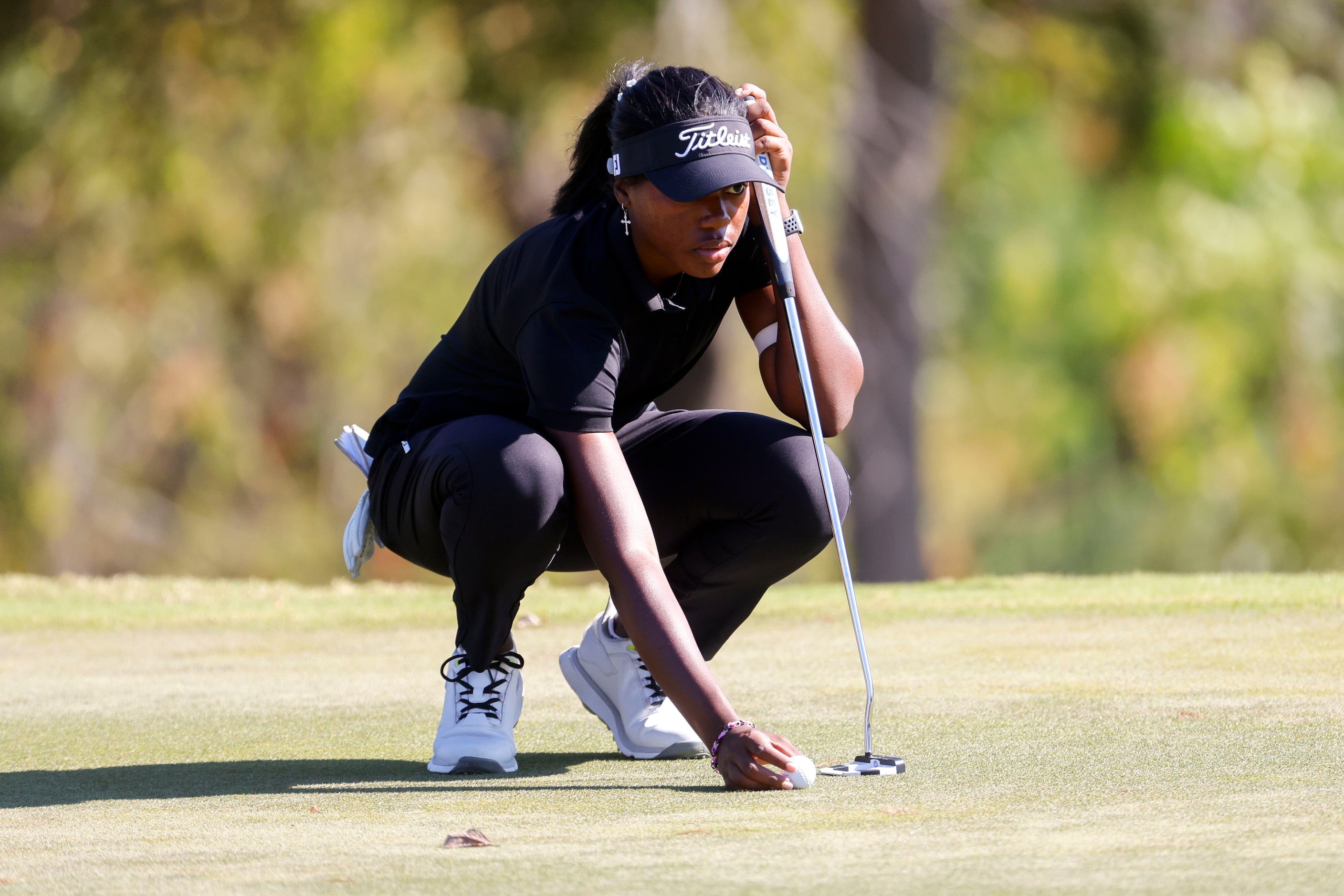 Shyla Brown of McKinney, lines up her putt in the third hole during the Southwest Airlines...