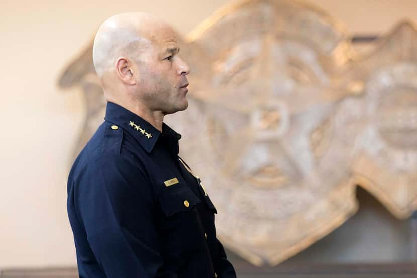 Dallas police Chief Eddie García watches body-cam footage of a shooting involving an officer...