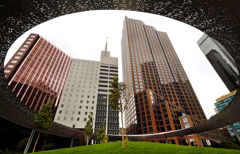 Downtown Dallas buildings are seen from Pacific Plaza, a new Dallas park project along...