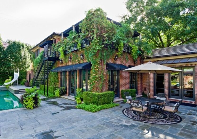 The home's guest house overlooks the pool and yard.