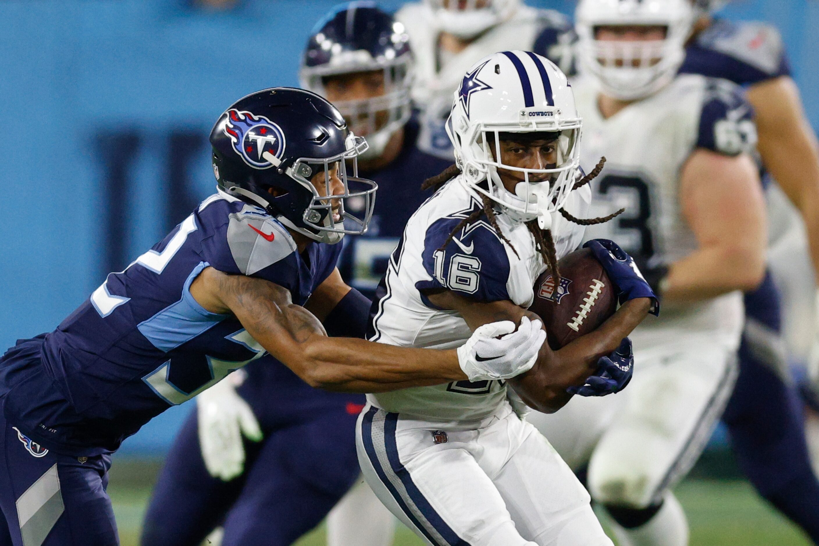 Tennessee Titans cornerback Greg Mabin (32) tackles Dallas Cowboys wide receiver T.Y. Hilton...