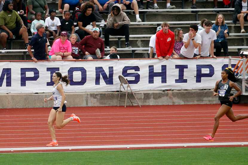 Flower Mound's Nicole Humphries, left, widens the margin of victory down the stretch to win...