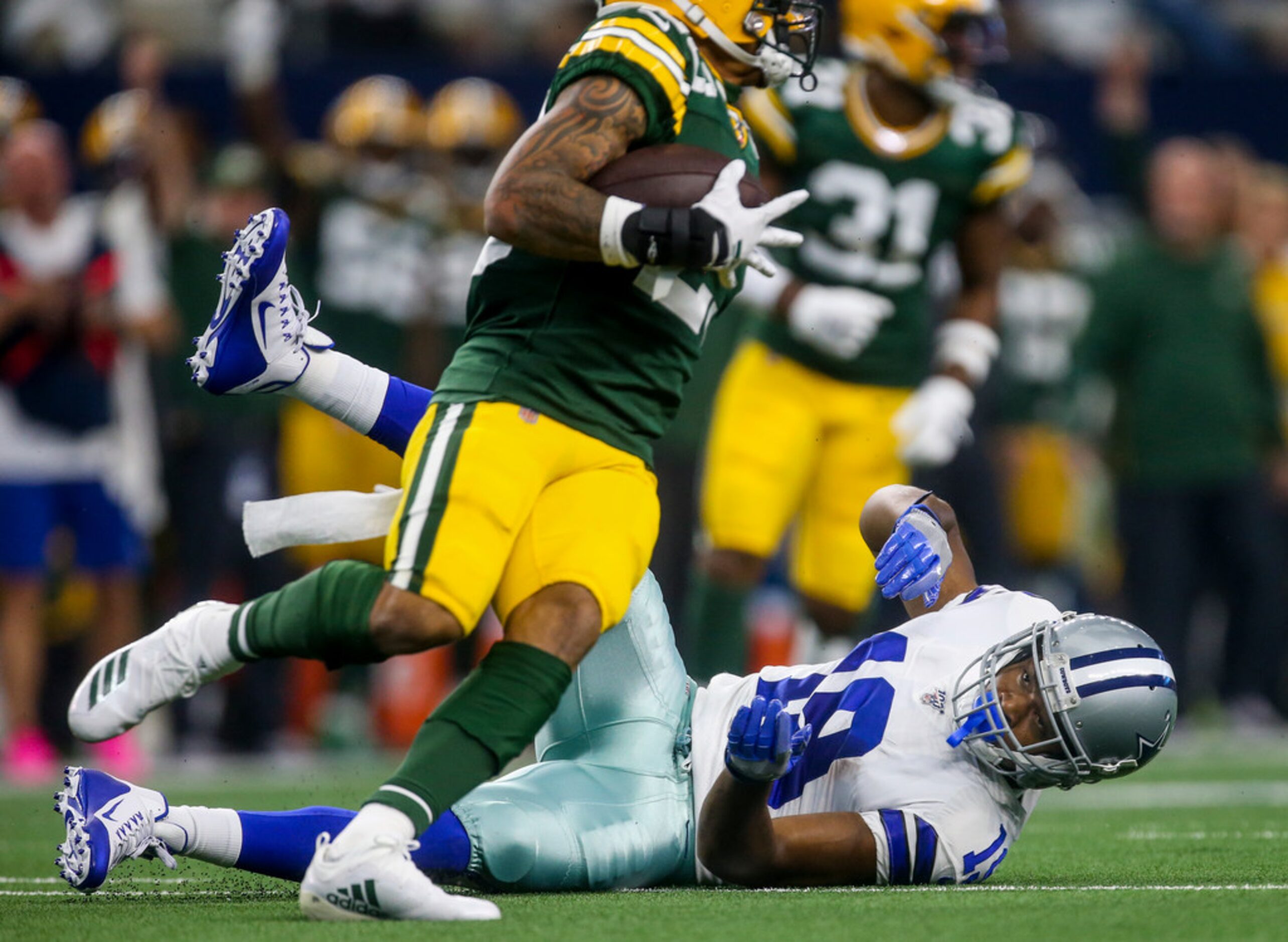 Dallas Cowboys wide receiver Amari Cooper (19) looks on after Green Bay Packers cornerback...