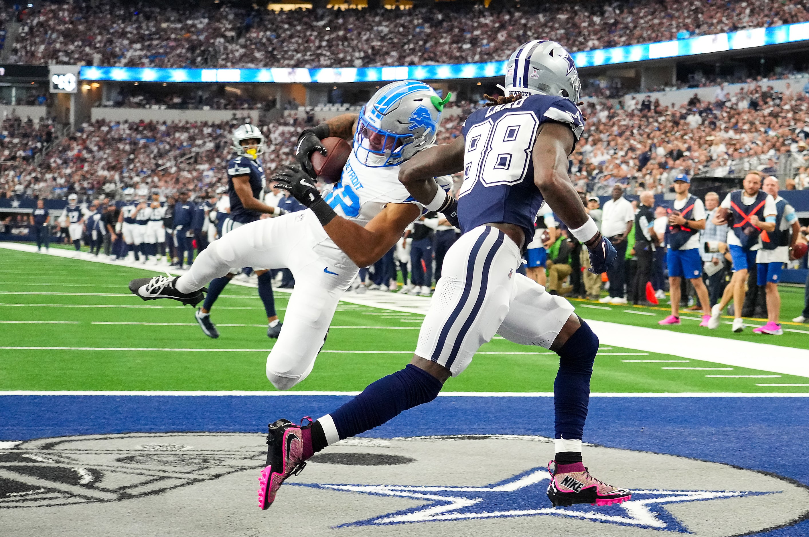 Detroit Lions safety Brian Branch (32) intercepts a pass intended for Dallas Cowboys wide...