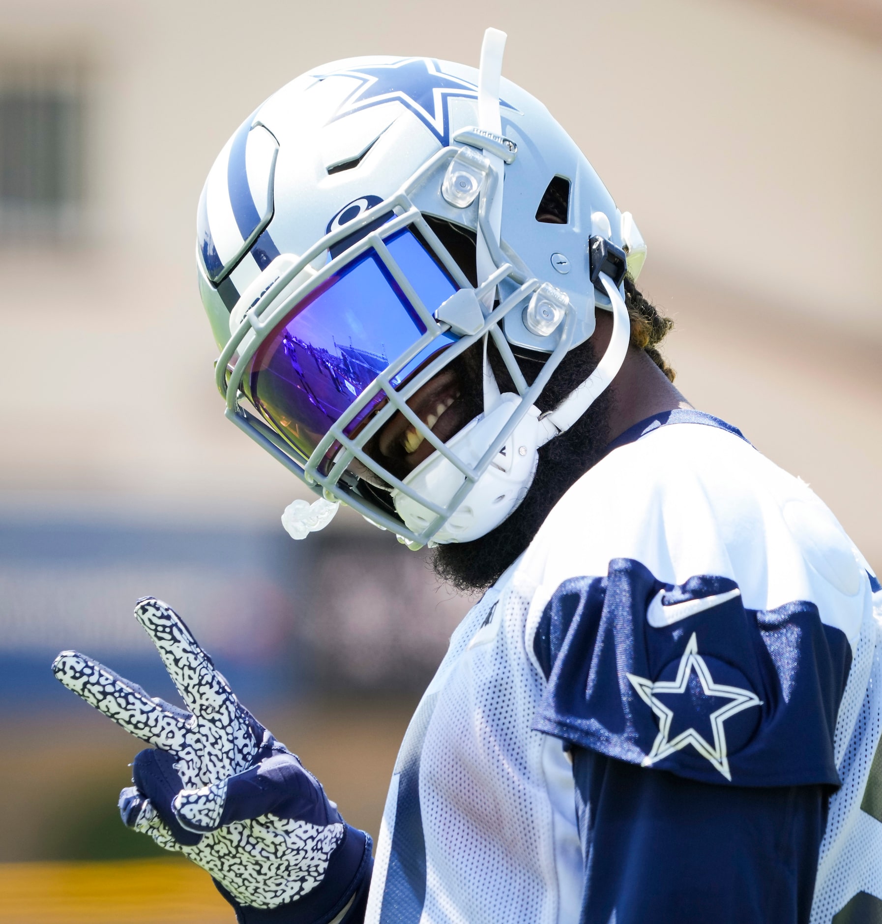 Dallas Cowboys running back Ezekiel Elliott (21) gestures to fans wishing him happy birthday...