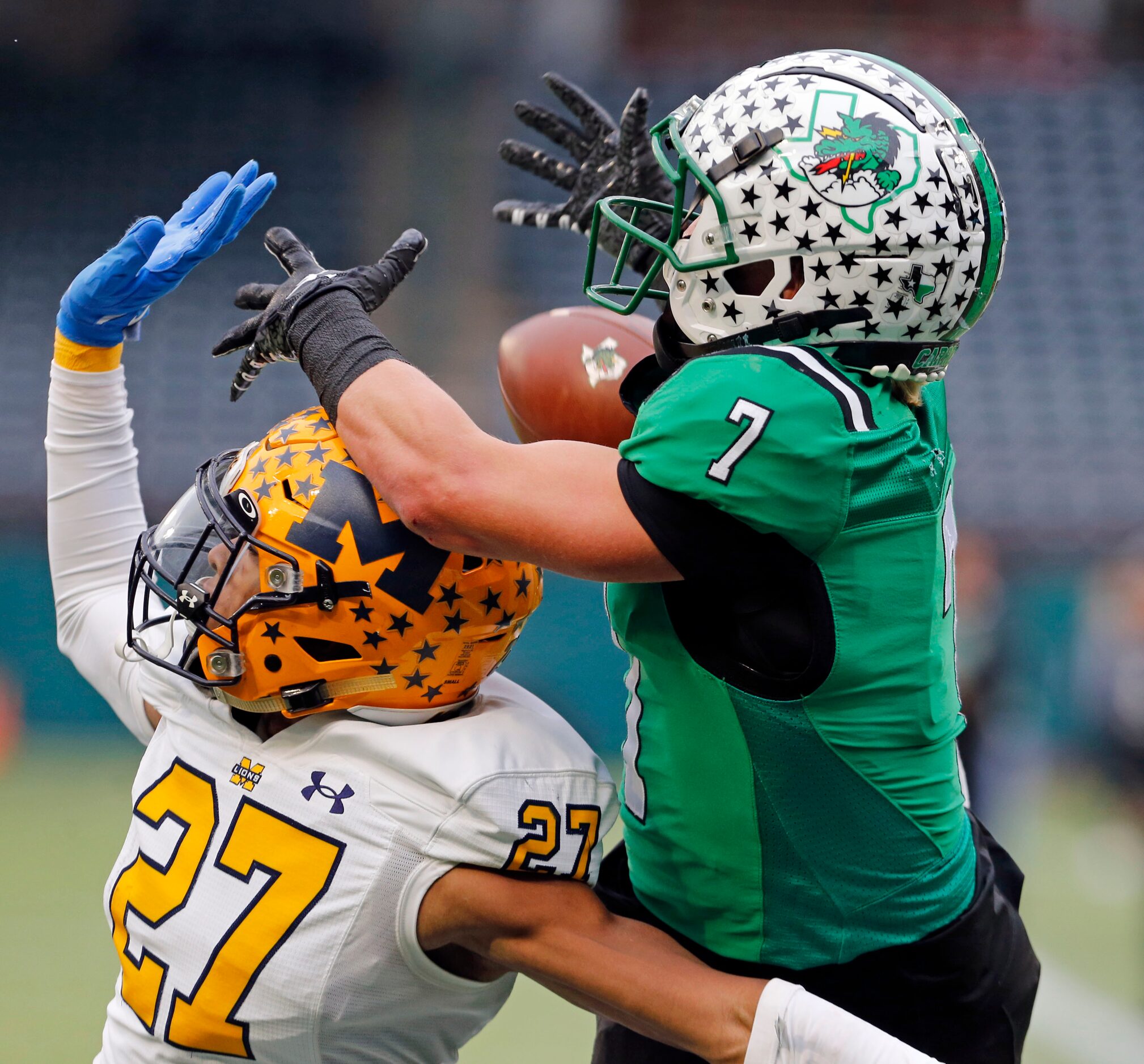 McKinney’s Zadian Burris (27) and Southlake’s Jacob Jordan (7) battle for a pass that fell...