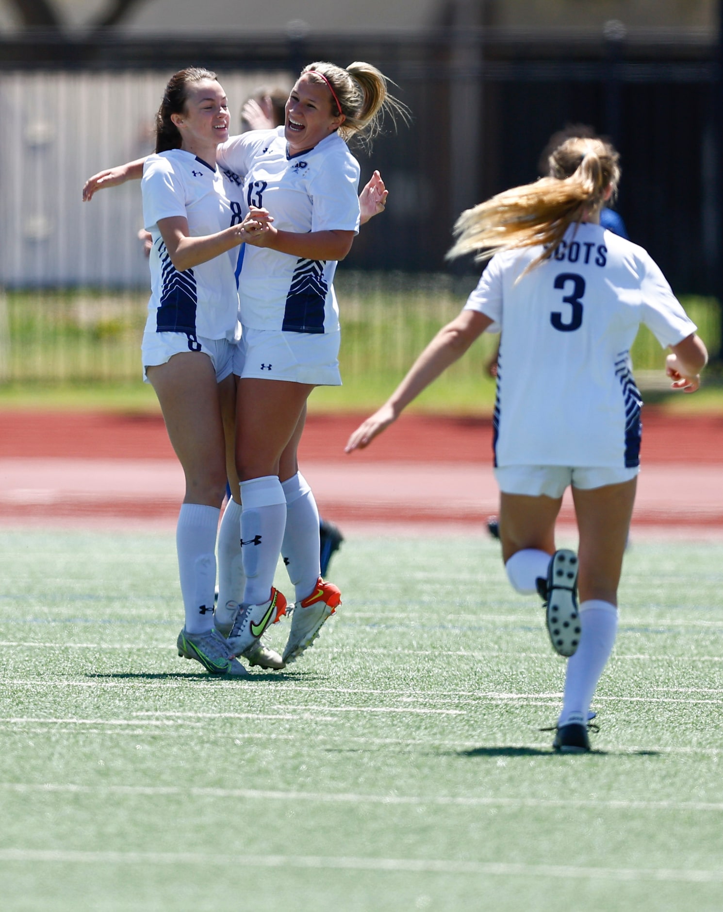 Highland Park’s Elise Borders (13) is congratulated by teammates after scoring a goal during...