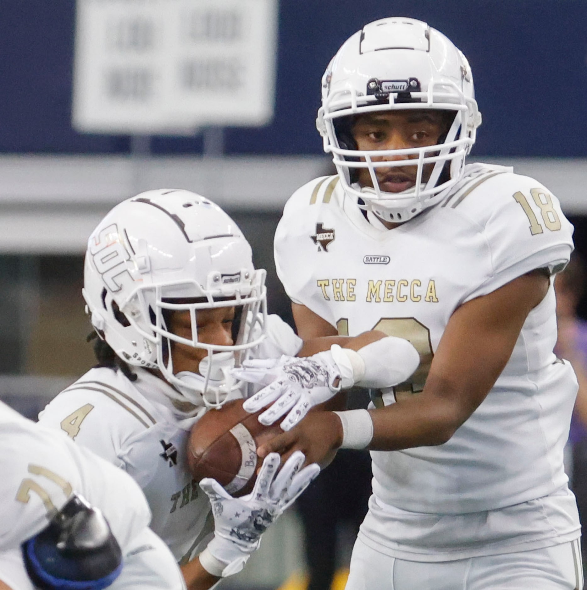 South Oak Cliff’s running back Khalil Ewell (left) receives the ball from QB William Little...