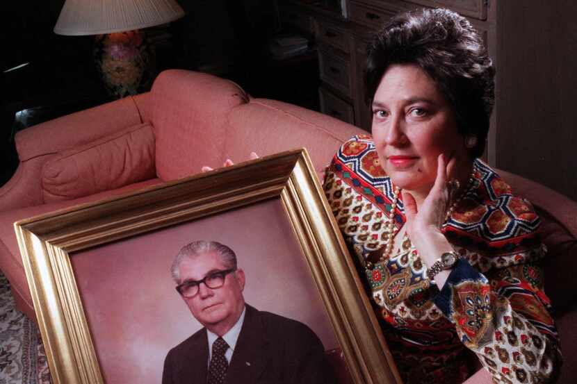 Camille Keith (at right) posed with a portrait of her late father, Marvin Keith, in 1996 as...