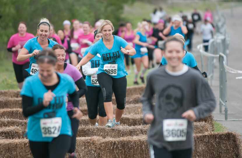 Women competing in the Dirty Girl Mud Run at Cedar Hill State Park on Saturday, Oct. 6, 2012.  