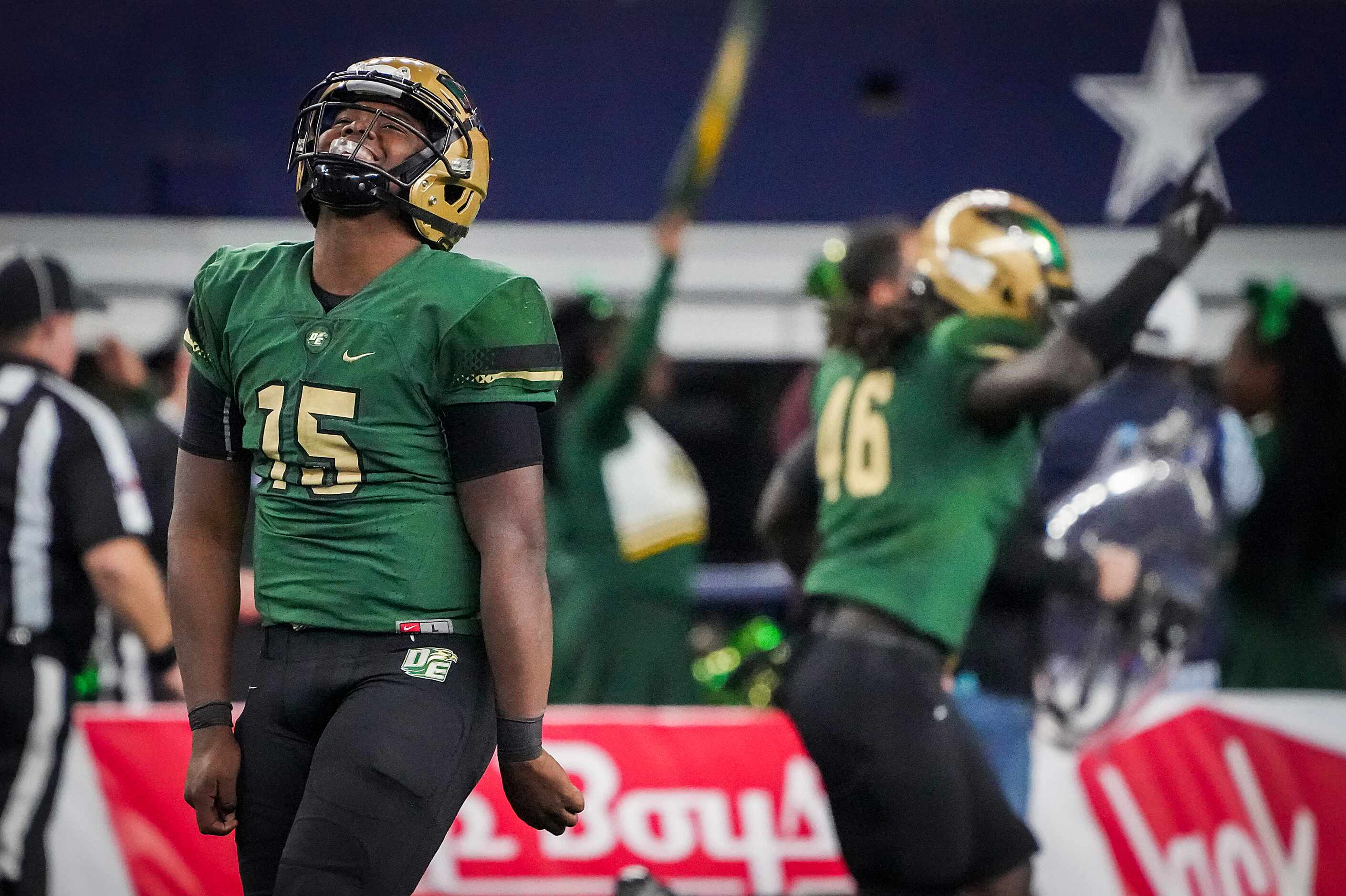 DeSoto quarterback Darius Bailey (15) celebrates after throwing a touchdown pass during the...