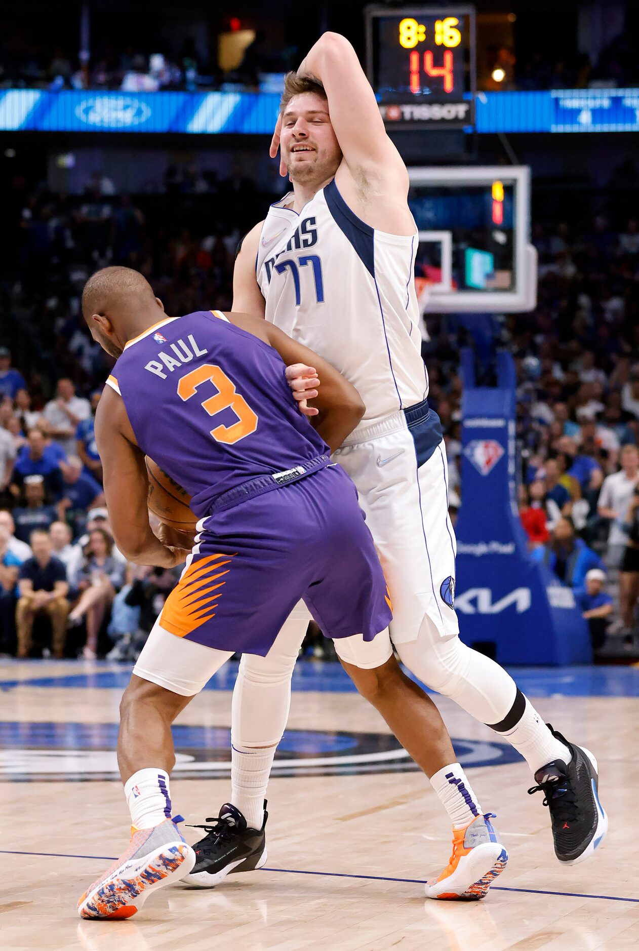 Dallas Mavericks guard Luka Doncic (77) has the ball stolen from him by Phoenix Suns guard...