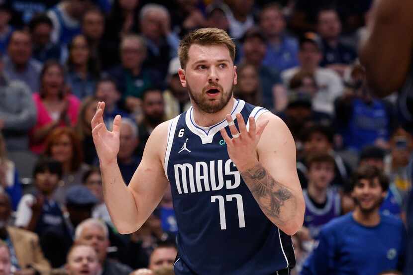 Dallas Mavericks guard Luka Doncic (77) reacts during the first half of an NBA game against...