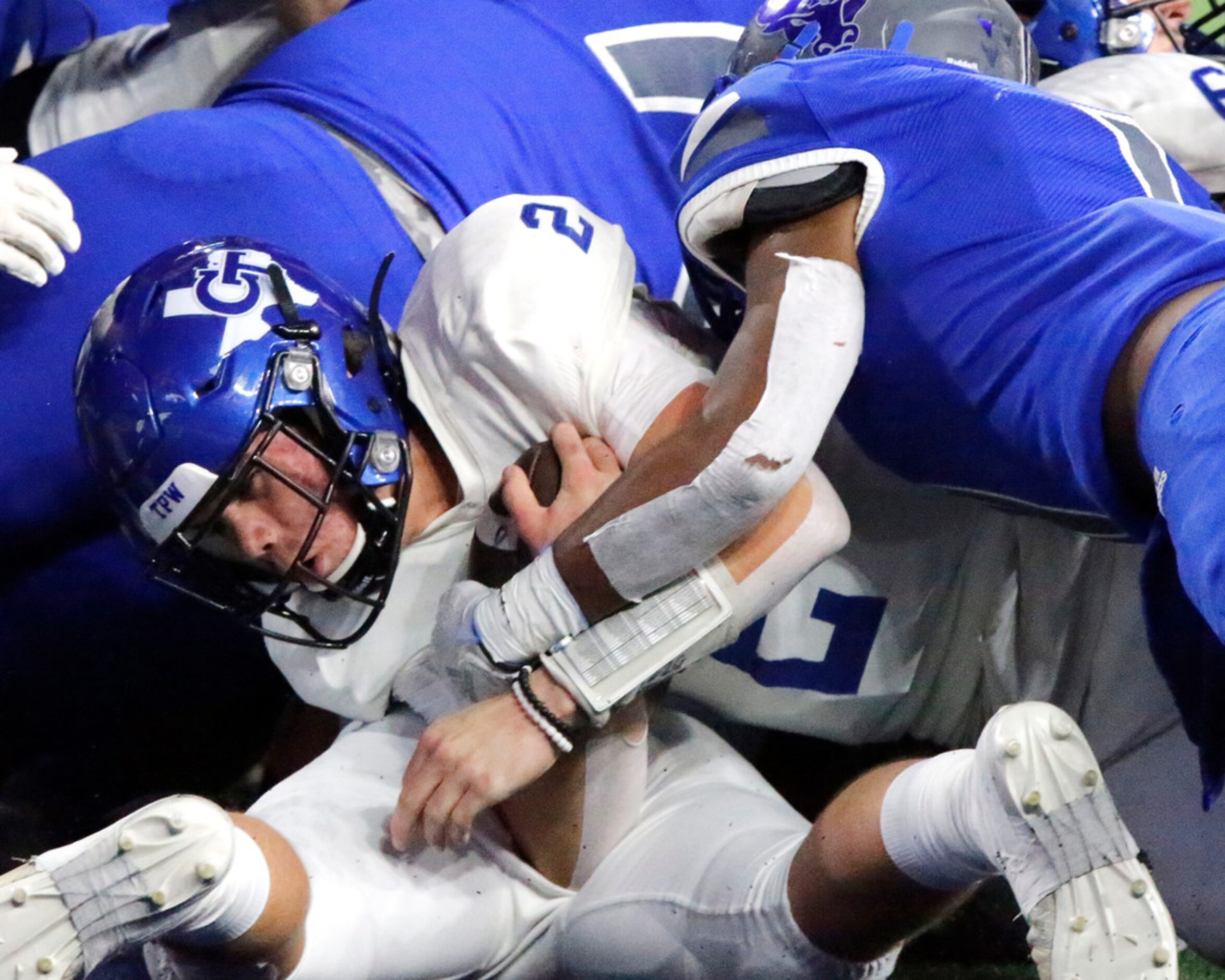 Gunter High School quarterback Hut Graham (2) dives across the goal line during the first...