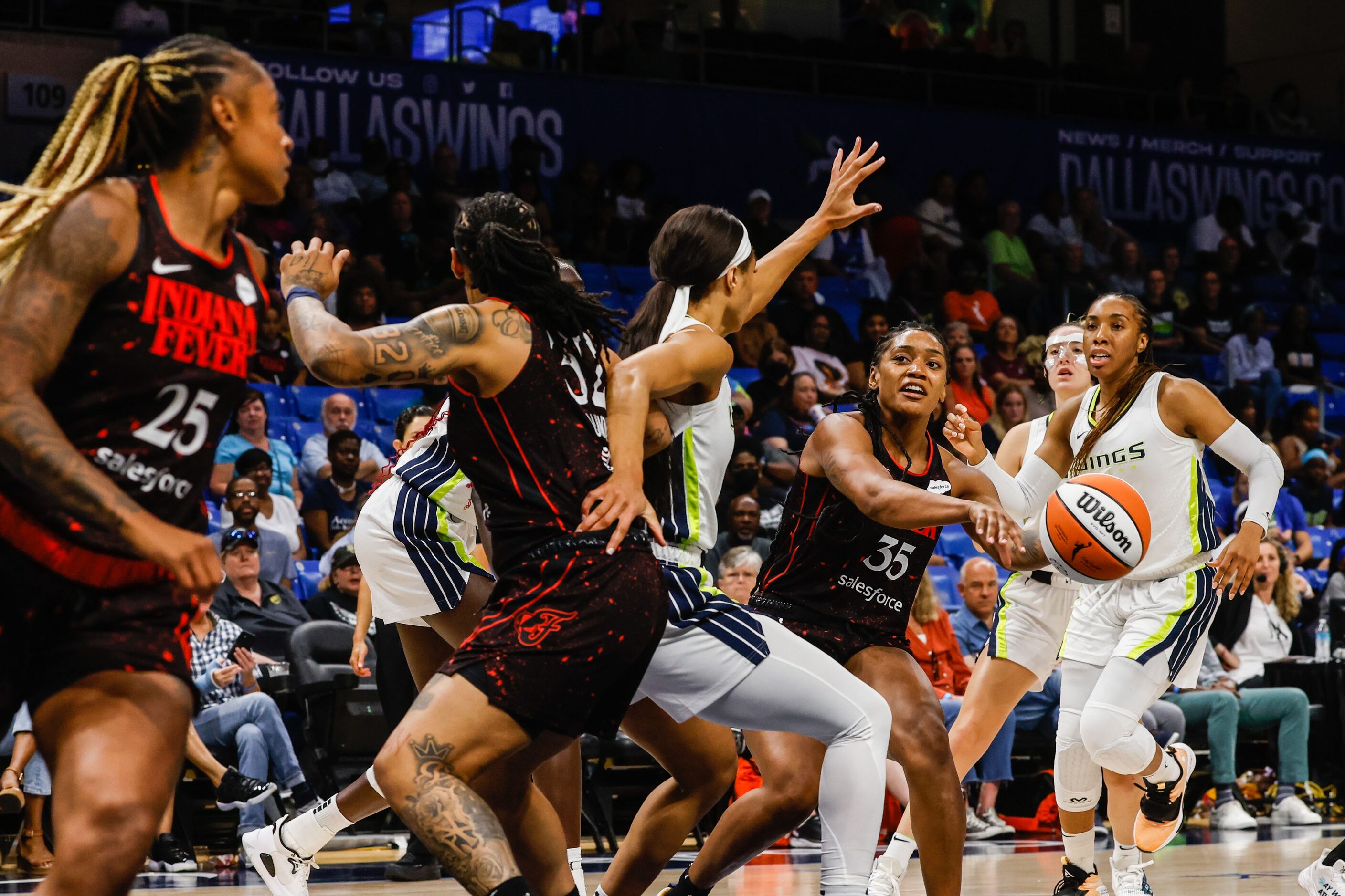 Indiana Fever guard Victoria Vivians (35) makes a pass to guard Tiffany Mitchell (25) next...