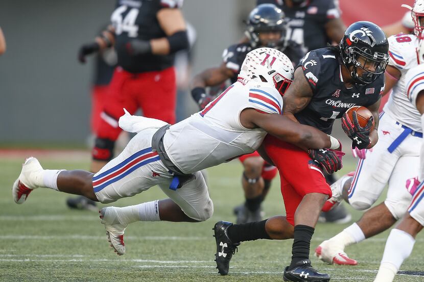 CINCINNATI, OH - OCTOBER 21: Kahlil Lewis #1 of the Cincinnati Bearcats runs the ball as...