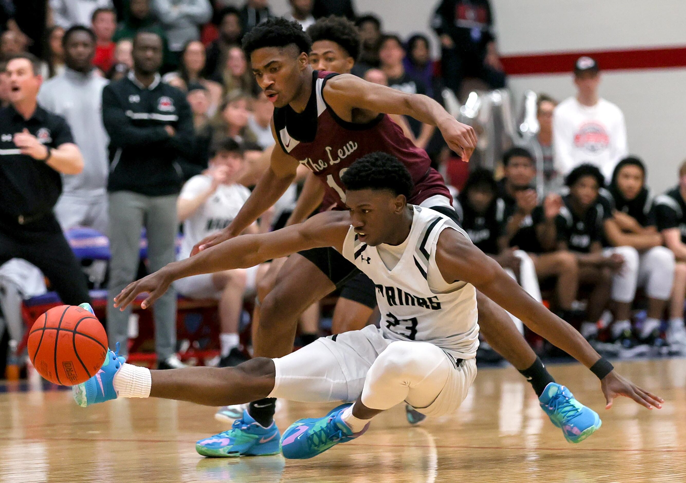 Arlington Martin guard Kordelius Jefferson (23) loses the ball  against Lewisville guard...