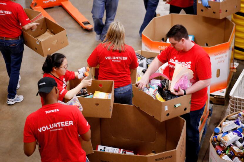 Toyota workers/volunteers working at a food bank