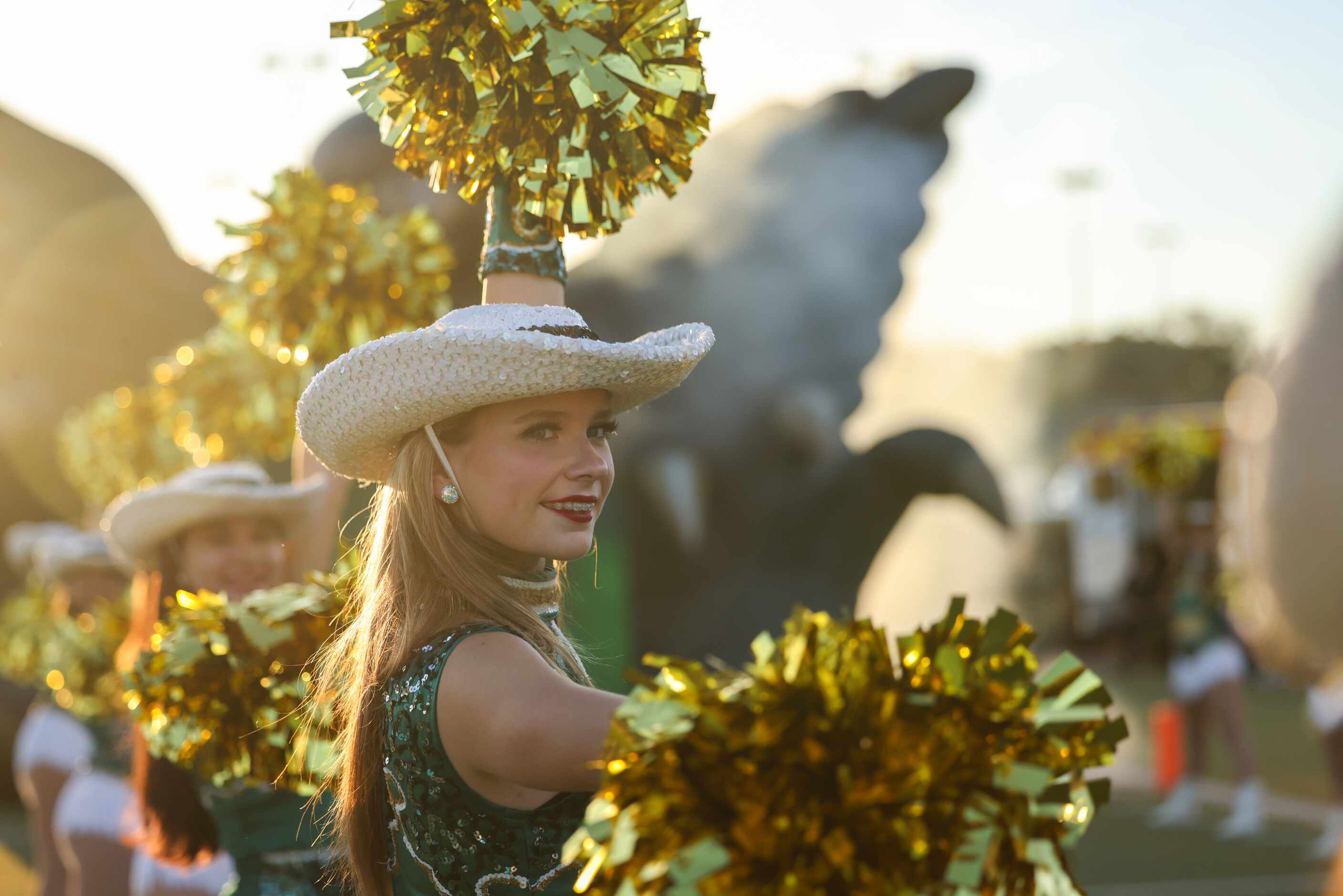 Birdville’s drill team prepare for their team to enter the field before a game against...