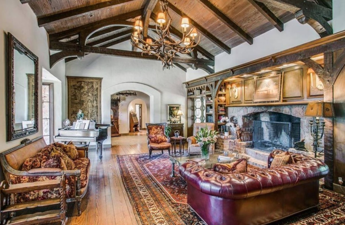 An antler chandelier hangs above one living area in the main home at Paigebrooke in Westlake.