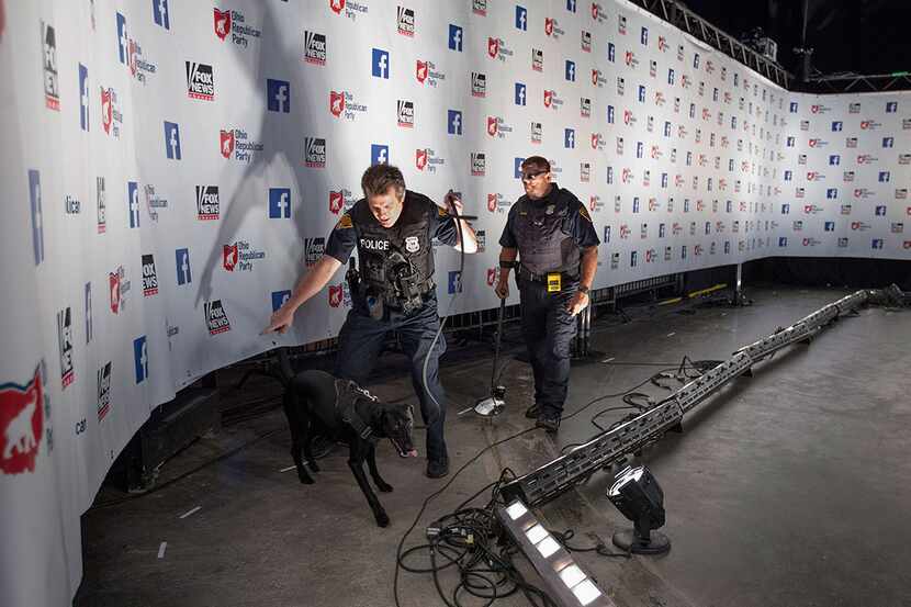  CLEVELAND, OH - AUGUST 06: Police use a K9 to search the 'Spin Alley' area ahead of the...