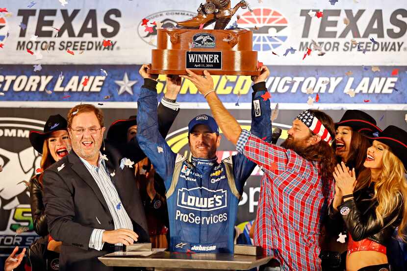 Eddie Gossage (left) and Willie Robertson (right) celebrate with Sprint Cup Series driver...