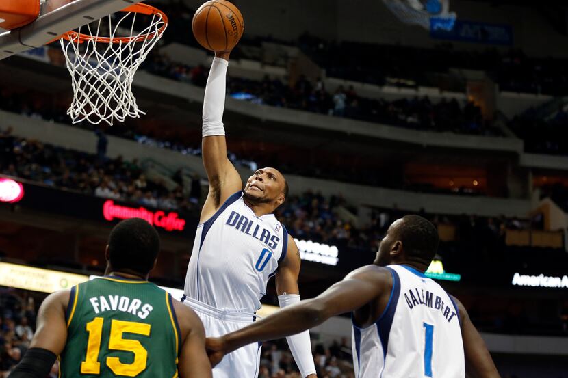 Dallas Mavericks small forward Shawn Marion (0) jumps for a dunk as Utah Jazz center Derrick...
