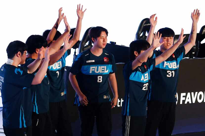 The Dallas Fuel team acknowledges their fans after defeating the Houston Outlaws in their...