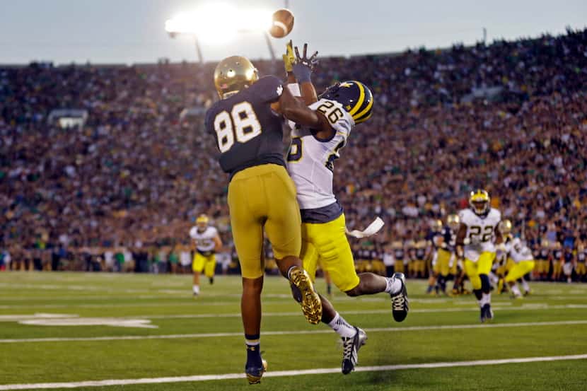 FILE - In this Sept. 6, 2014, file photo, Michigan defensive back Jourdan Lewis, right,...