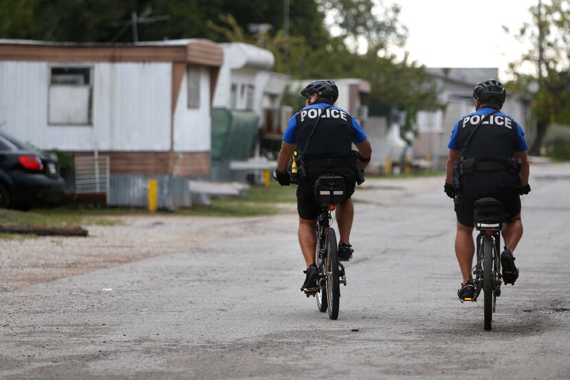 McKinney neighborhood police officers Randy Patton (right) and Sgt. Damian Guerrero patrol...