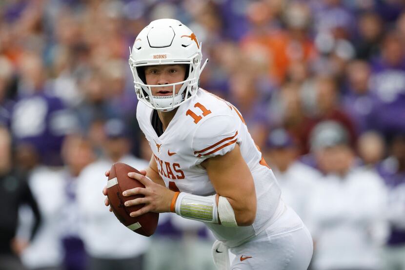 FILE - In this Sept. 29, 2018, file photo, Texas quarterback Sam Ehlinger looks for an open...