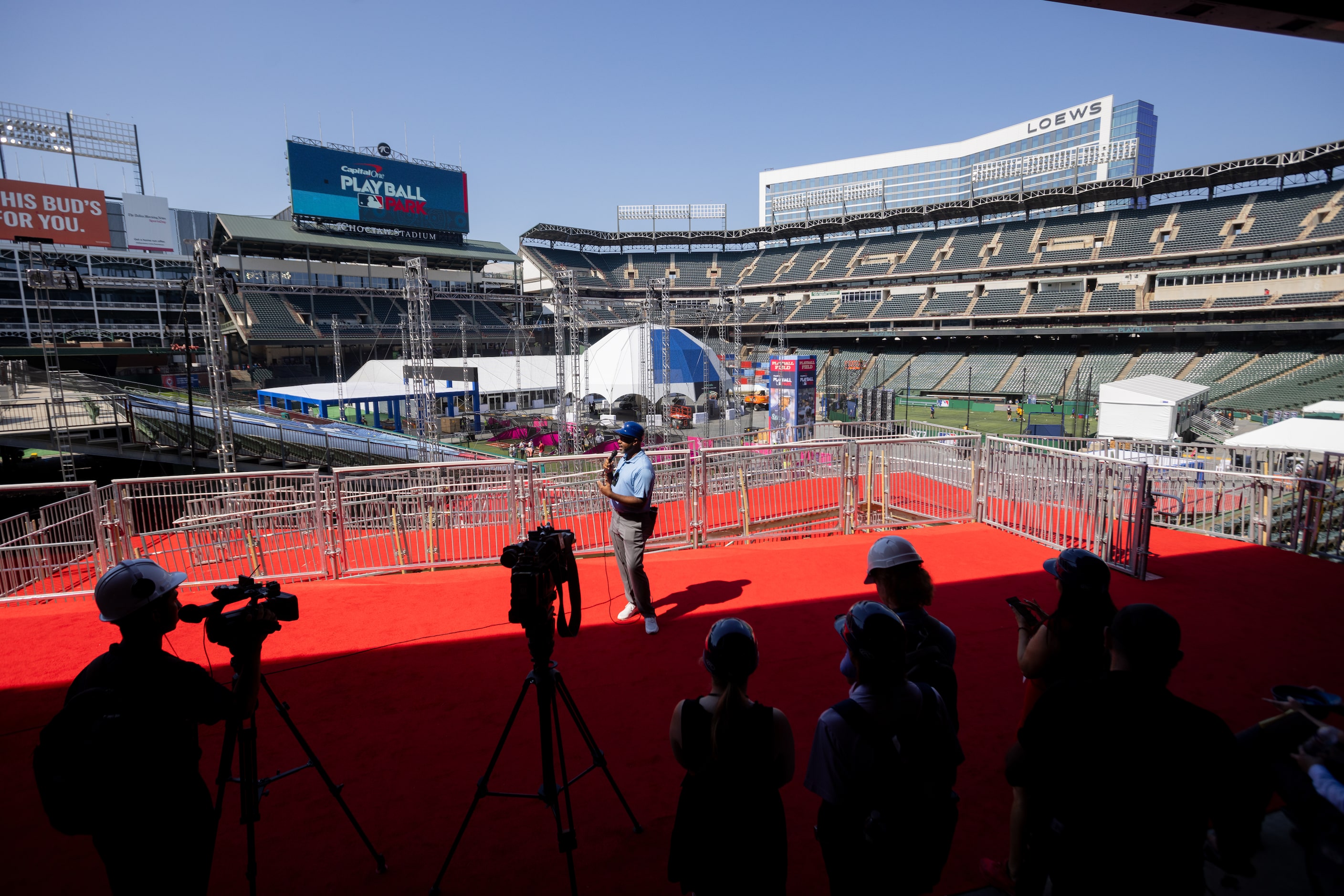 Robert Field, senior manager for global events at MLB, gives a hardhat tour to press at...