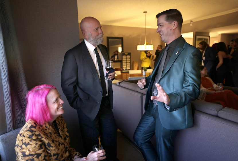 Caryn Ann Harlos, left, and David Constant speak with candidate Chase Oliver during a...