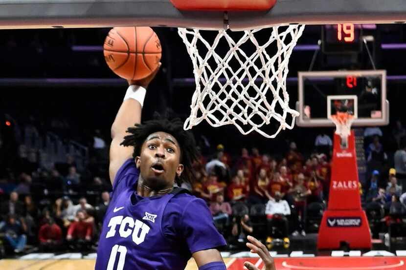 TCU forward Kaden Archie, left, goes up for a dunk as Southern California forward Victor...