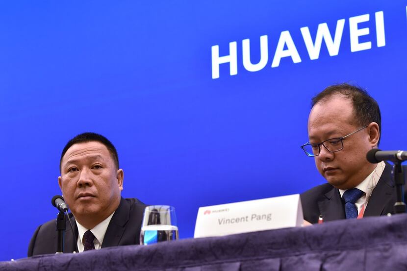 Song Liuping (left), chief legal officer of Chinese tech giant Huawei, and Vincent Pang,...