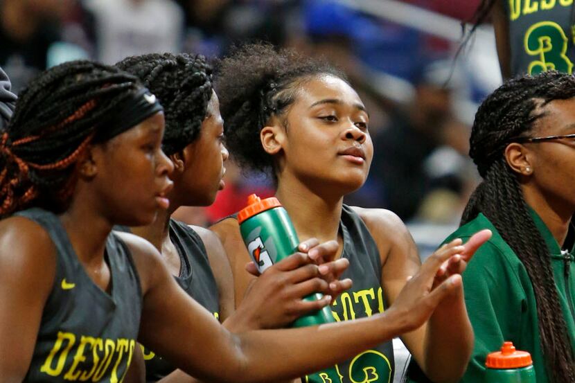 Desoto's Kendall Brown is congratulated as she came to the bench in closing minutes. UIL...