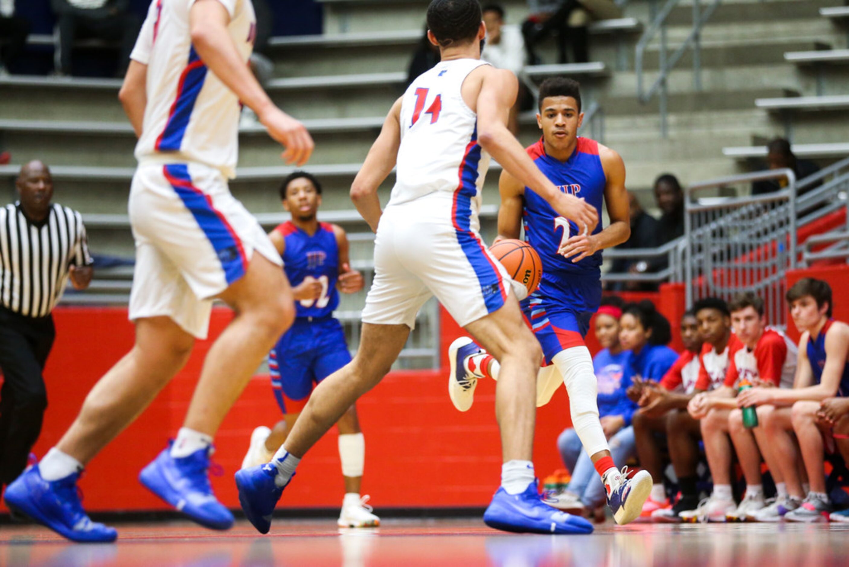 J. J. Pearce guard Sterling Hopkins (23) drives the ball down the court during a high school...