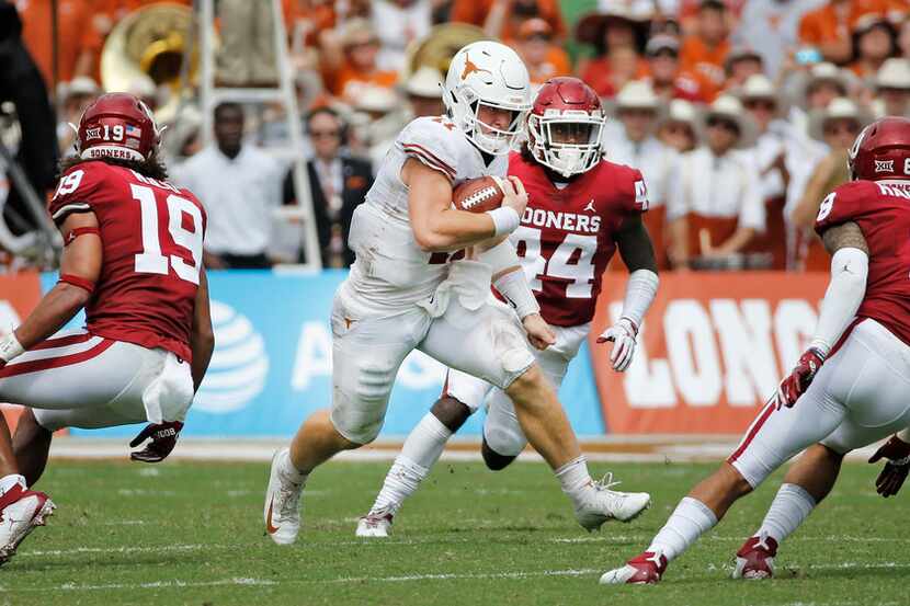 Texas Longhorns quarterback Sam Ehlinger (11) runs for yardage during the University of...