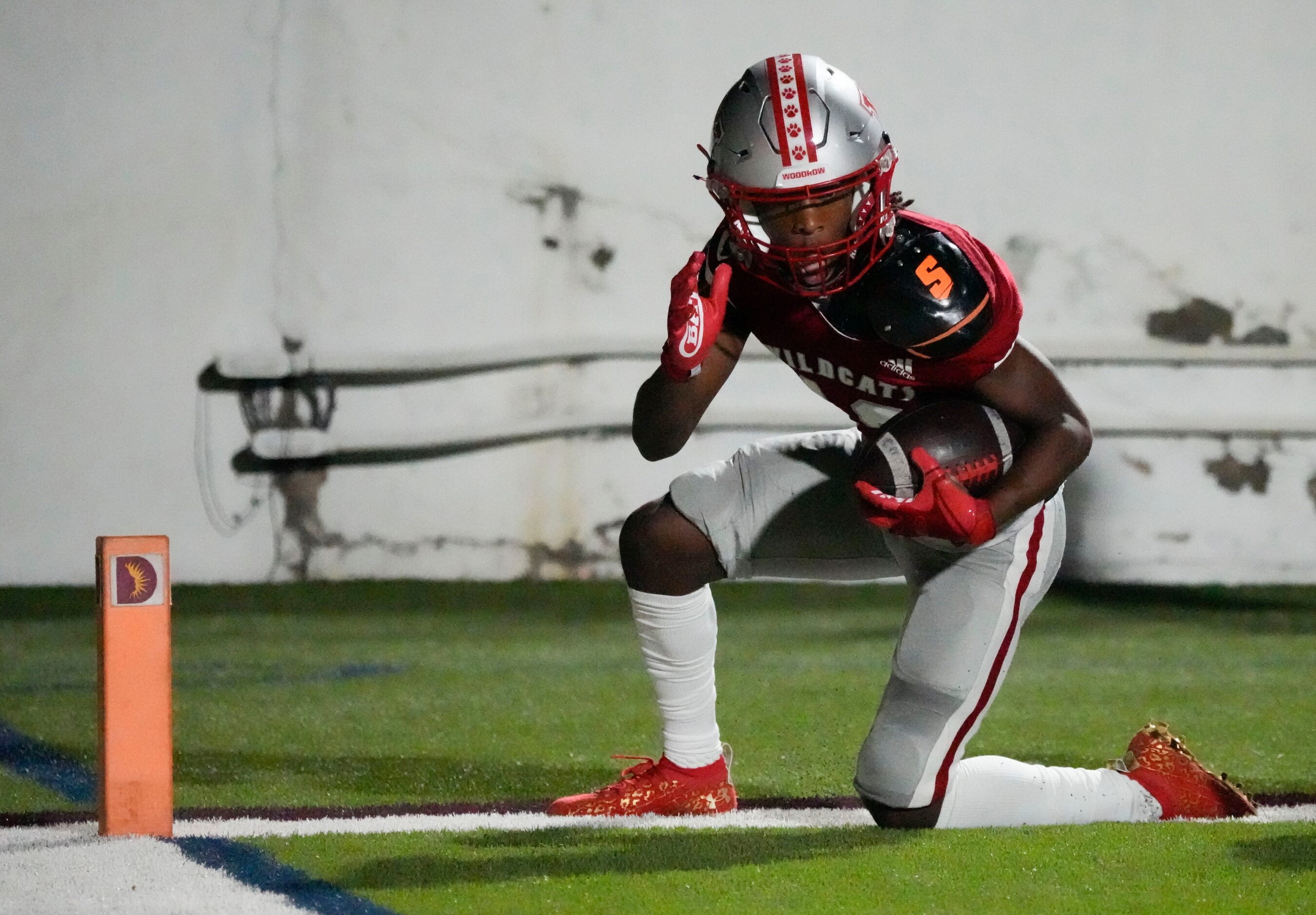 Woodrow Wilson junior wide receiver Cyris Taylor (13) celebrates scoring a touchdown during...