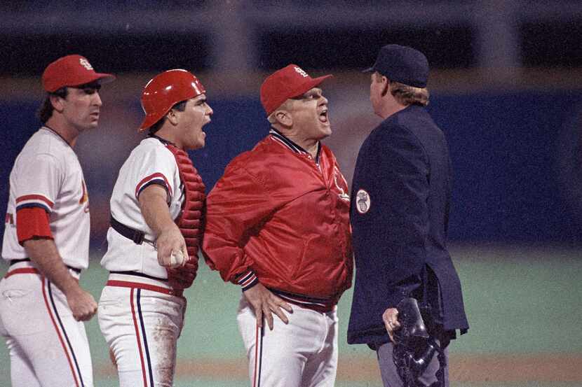 FILE - St. Louis Cardinals manager Whitey Herzog lets umpire John Shulock, right, know how...