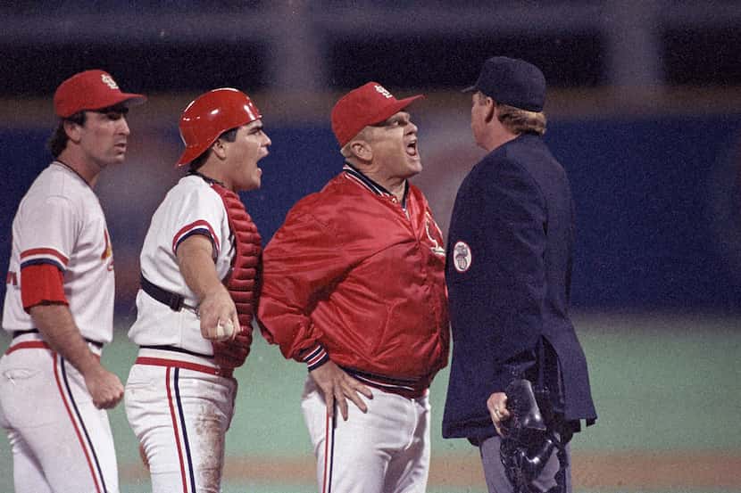 FILE - St. Louis Cardinals manager Whitey Herzog lets umpire John Shulock, right, know how...