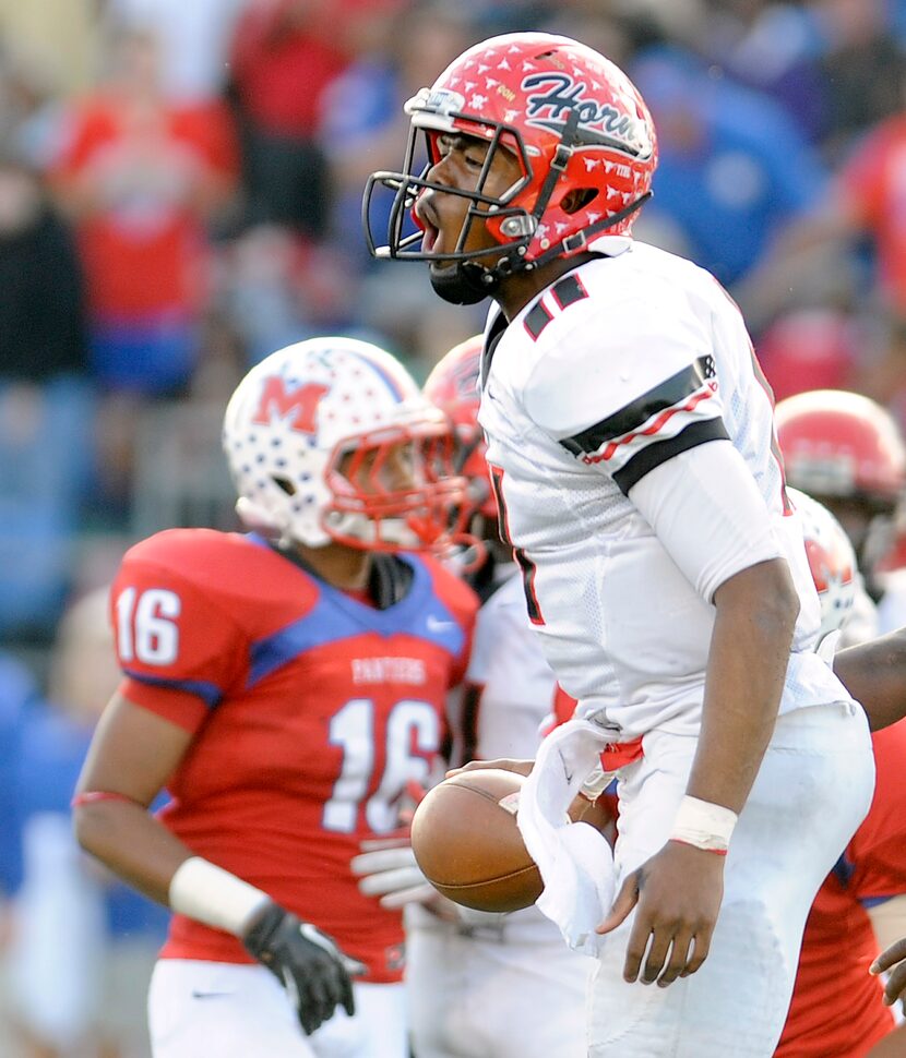 Cedar Hill's Damion Hobbs (11) celebrates after a first down in the second half during the...