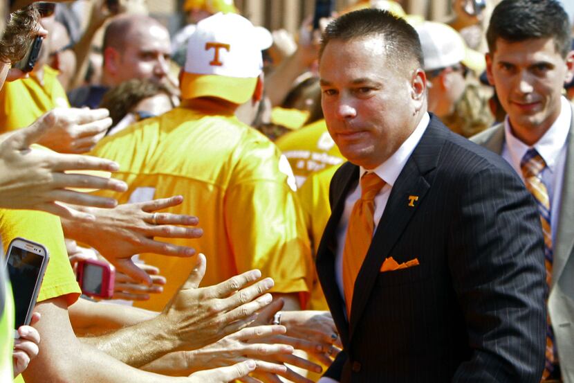 Butch Jones brings his Tennessee team to Norman in 2014. (AP Photo/Wade Payne)