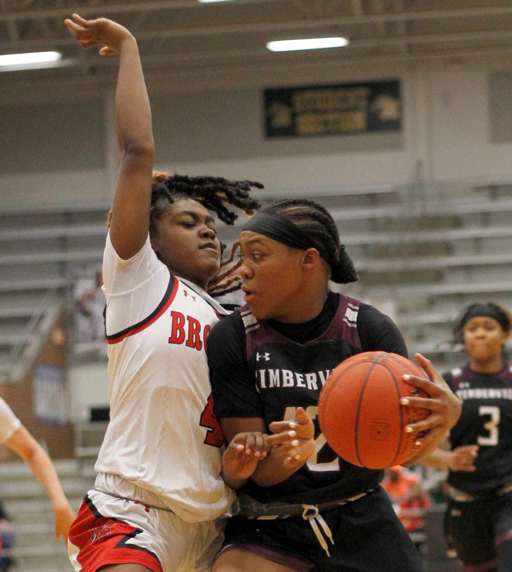 Mansfield Timberview guard Crishawn Coleman (12) drives against the defense of Mansfield...