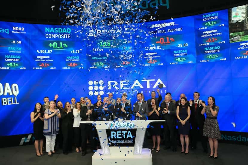 Warren Huff (center), chief executive of Reata Pharmaceuticals, rang the closing bell at...
