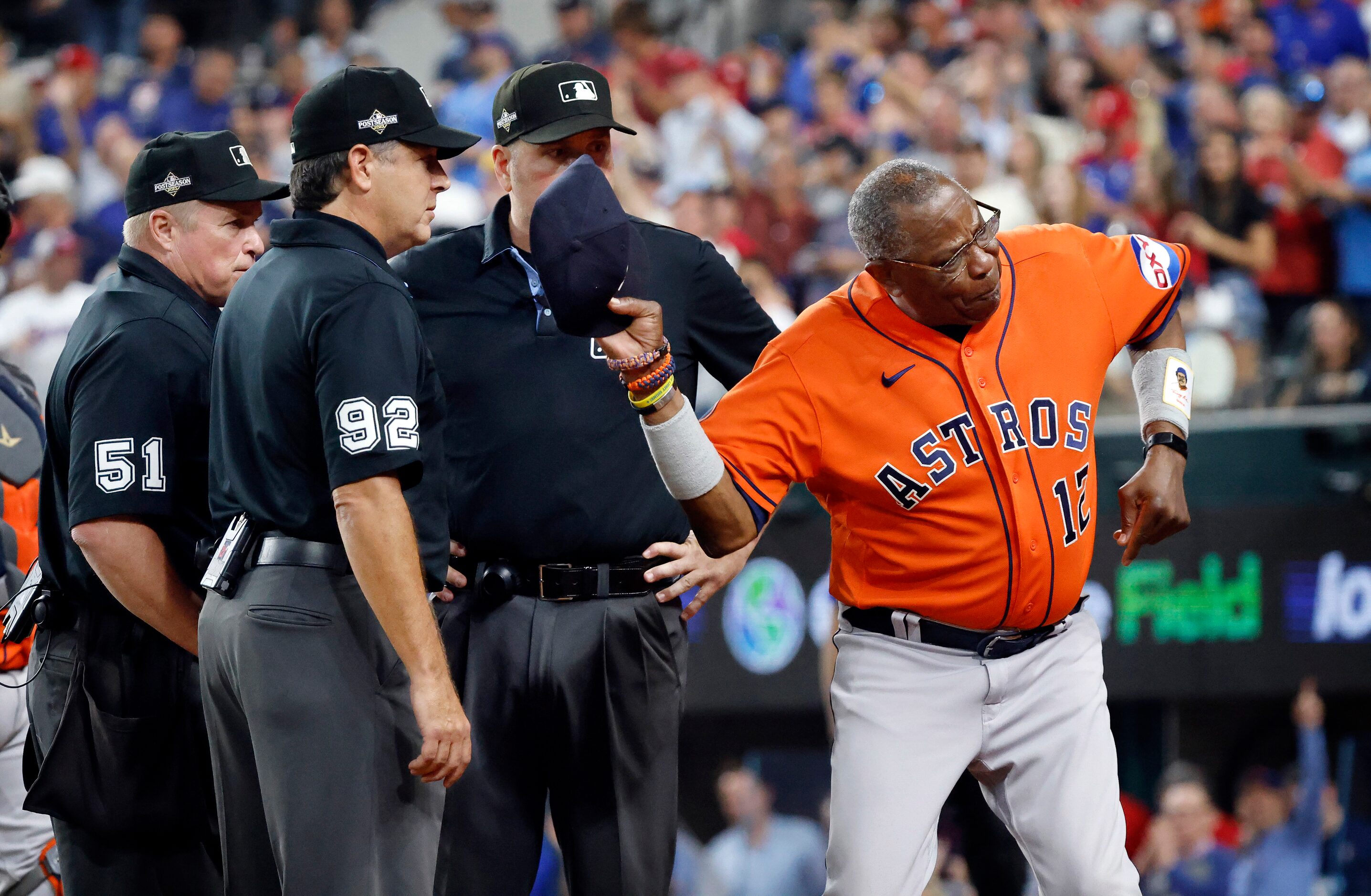 Houston Astros manager Dusty Baker throws his hat to the dugout before left field umpire...