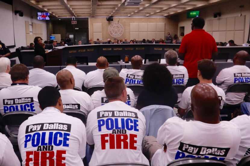 Dallas police officers, first responders and their supporters rallied for raises at an...
