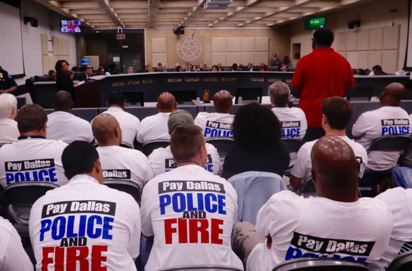 Dallas police officers, first responders and their supporters rallied for raises at an...