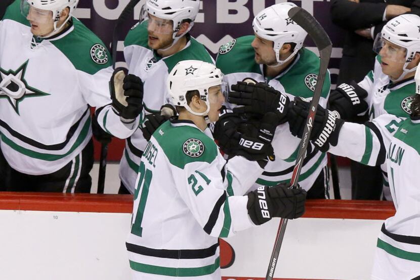 Dallas Stars' Antoine Roussel (21) celebrates his goal against the Phoenix Coyotes with...