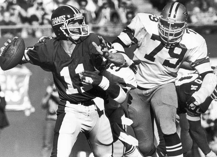 1979 -- Harvey Martin, shown zeroing in on Giants quarterback Phil Simms, played for the...